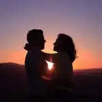 silhouette of hugging couple